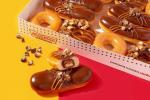Krispy Kreme acaba de revelar três rosquinhas Twix, e uma é recheada com uma barra de chocolate em tamanho real
