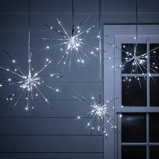 4 luzes de Natal cintilantes de prata Starburst