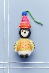 Ornamento acolhedor do pinguim 